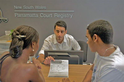 Image of a couple in a court registry.