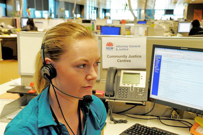 Image of a CJC staff member on the phone.